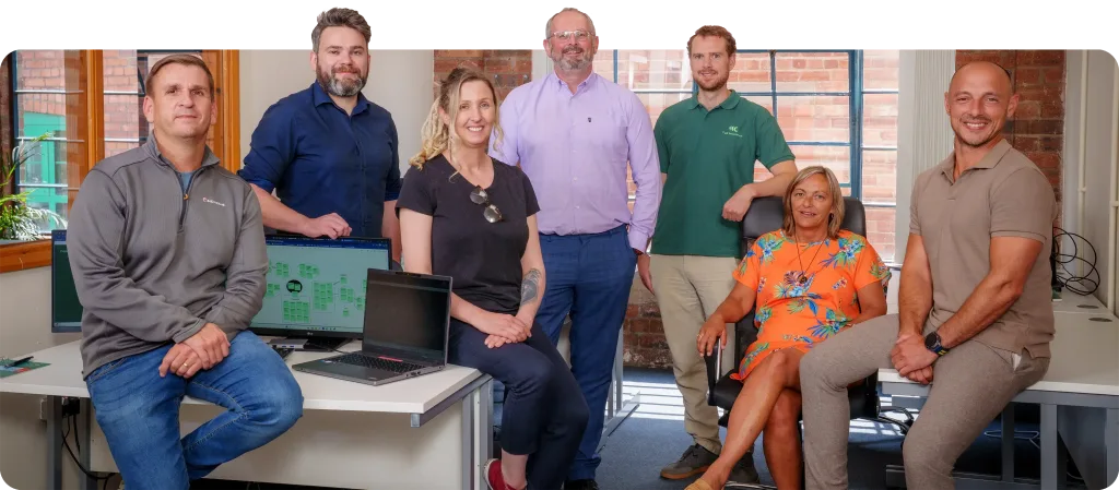 Team photograph of a group of people smiling together